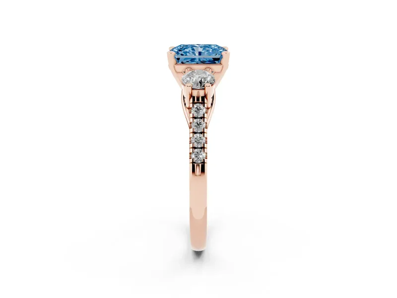 Fancy Blue Three-Stone Radiant Cut Diamond Pavé Band Ring Set in Rose gold with Prong-Set Trio