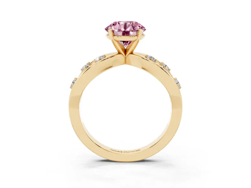 Fancy Pink Round Cut Diamond Solitaire Ring Set in Yellow gold with Side Stones on Criss-Cross Band and Prong Setting