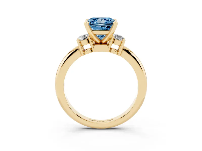 Fancy Blue Three-Stone Princess Cut Diamond Ring Set in Yellow gold with Prong Setting and Plain Band