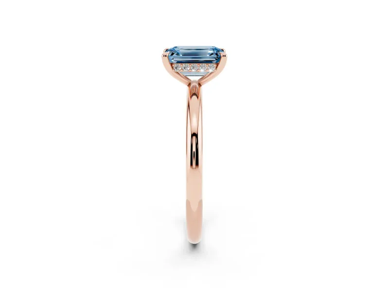 Fancy Blue Emerald Cut Diamond Solitaire Ring Set in Rose gold with Thin Band and Prong Setting