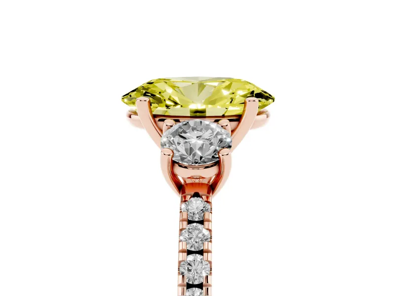 Fancy Yellow Oval Cut Diamond Three-Stone Ring Set in Rose gold with Pavé Band and Graduated Sides