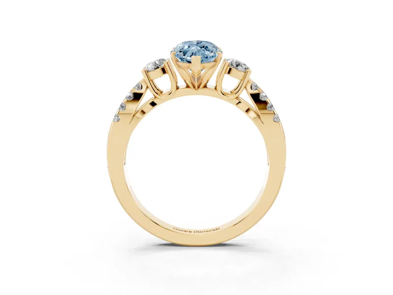 Fancy Blue Marquise Cut Diamond Three-Stone Ring Set in Yellow gold with Pavé Split Shank and Prong Setting