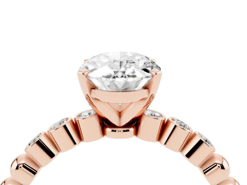 Oval Cut Diamond Solitaire Engagement Ring Set in Rose gold with Bezel Accents on Beaded Band