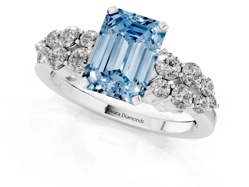Fancy Blue Emerald Cut Diamond Cluster Engagement Ring Set in White gold with Pavé Band and Prong Setting