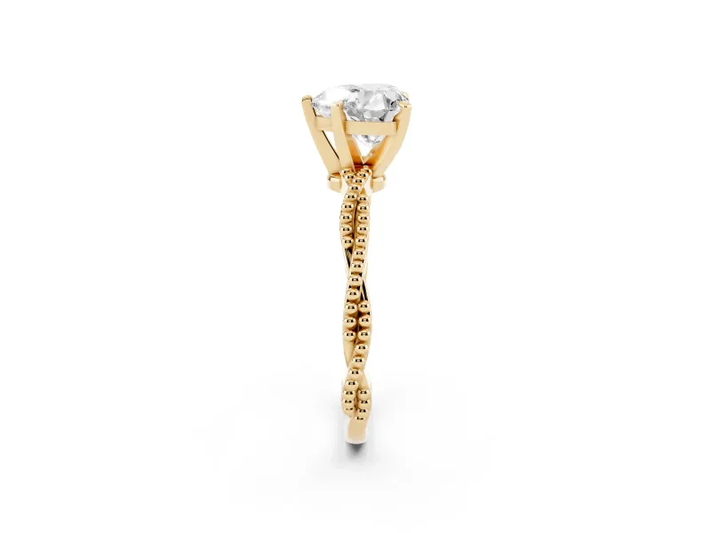 Heart Cut Diamond Solitaire Ring Set in Yellow gold with Twisted Band and Bead Prong Setting