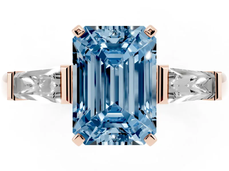 Fancy Blue Emerald Cut Diamond Solitaire Ring Set in Rose gold with Tapered Baguette Side Stones and Prong Setting