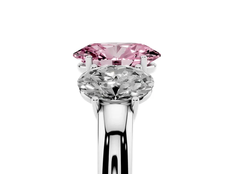 Fancy Pink Oval Cut Diamond Three-Stone Ring Set in White gold with Bold Center and Classic Band