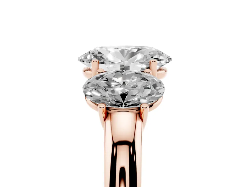Oval Cut Diamond Three-Stone Ring Set in Rose gold with Bold Center and Classic Band
