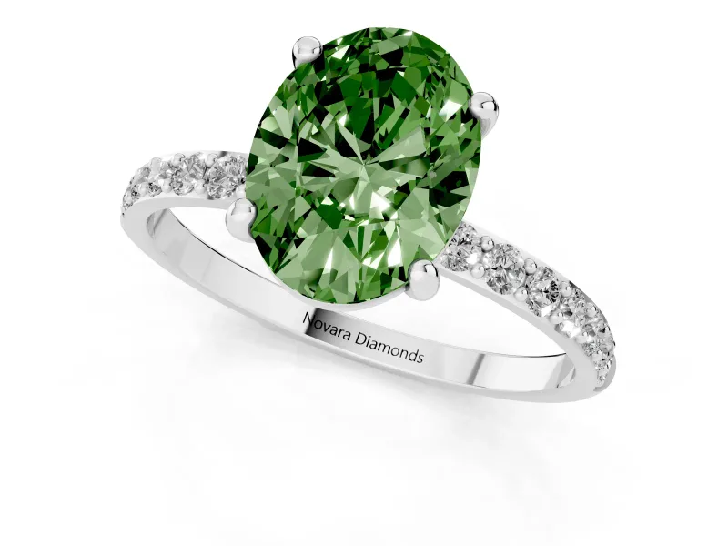 Fancy Green Oval Cut Diamond Solitaire Ring Set in Silver with Round Pavé Band and Prong Setting