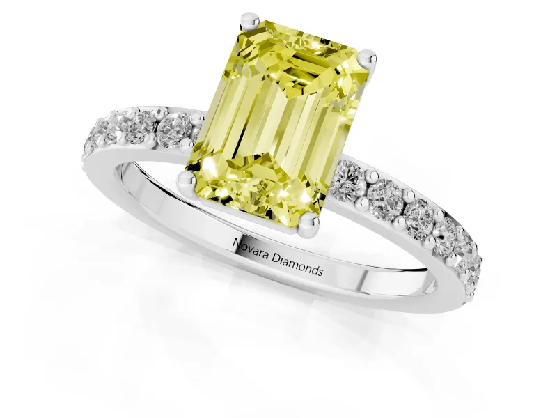 Fancy Yellow Emerald Cut Diamond Solitaire Set in White gold with Round Pavé Band and Prong Setting
