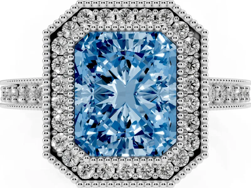 Fancy Blue Radiant Cut Diamond Halo Engagement Ring Set in White gold with Pavé Band and Round Halo Stones