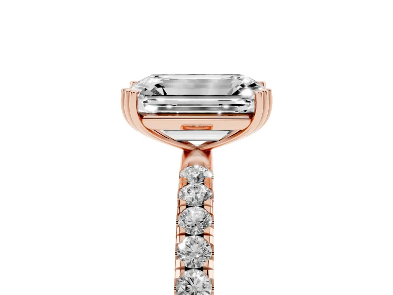 Emerald Cut Diamond Brilliant Solitaire Set in Rose gold with Pavé Band and Claw Prong Setting