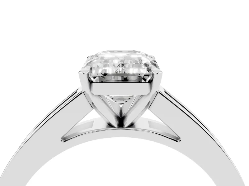 Emerald Cut Diamond Solitaire Ring Set in Platinum with Channel-Set Band and Prong Setting