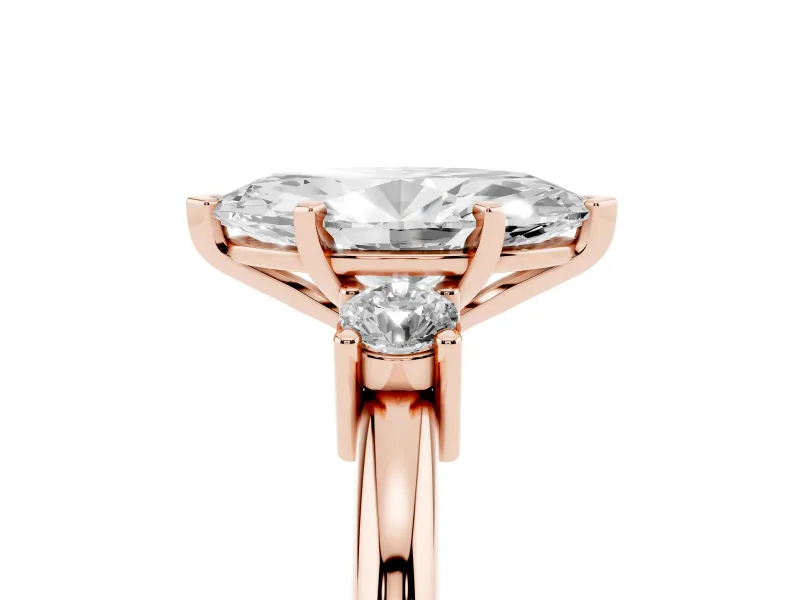 Three-Stone Marquise Cut Diamond Ring Set in Rose gold with Prong Setting and Plain Band