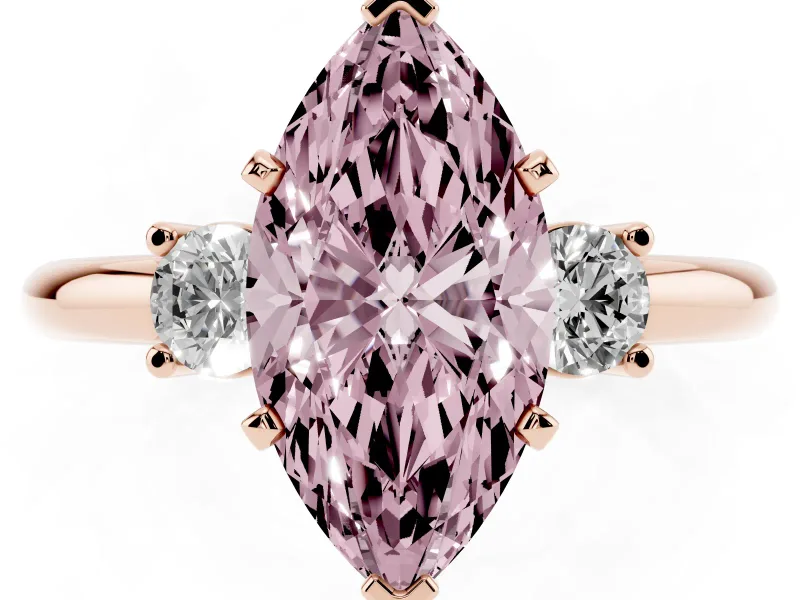 Fancy Pink Three-Stone Marquise Cut Diamond Ring Set in Rose gold with Prong Setting and Plain Band