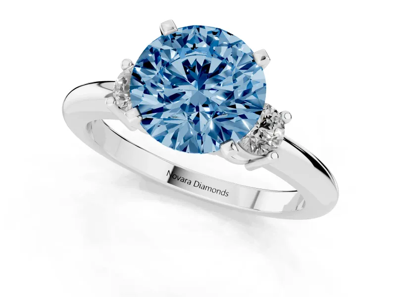 Fancy Blue Three-Stone Round Cut Diamond Ring Set in Platinum with Prong Setting and Plain Band