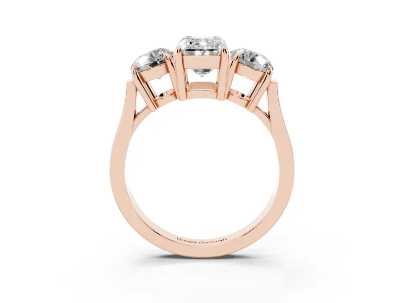 Emerald Cut Diamond Three-Stone Ring Set in Rose gold with Round Accent Stones and Plain Band