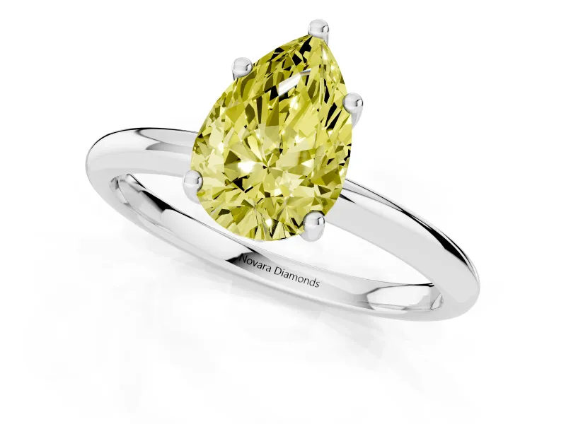 Fancy Yellow Pear Cut Diamond Solitaire Engagement Ring Set in Silver with Prong Setting and Polished Band