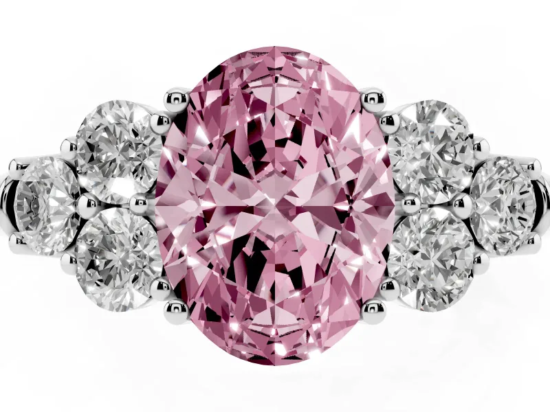 Fancy Pink Oval Cut Diamond Cluster Ring Set in White gold with Round Accent Stones and Prong Setting on a Plain Band