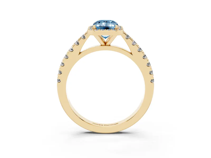 Fancy Blue Emerald Cut Diamond Halo Engagement Ring Set in Yellow gold with Pavé Band and Prong Setting