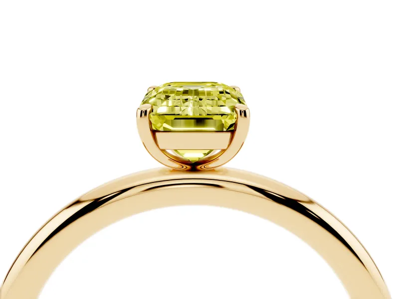 Fancy Yellow Emerald Cut Diamond Solitaire Ring Set in Yellow gold with Prong Setting on a Polished Plain Band