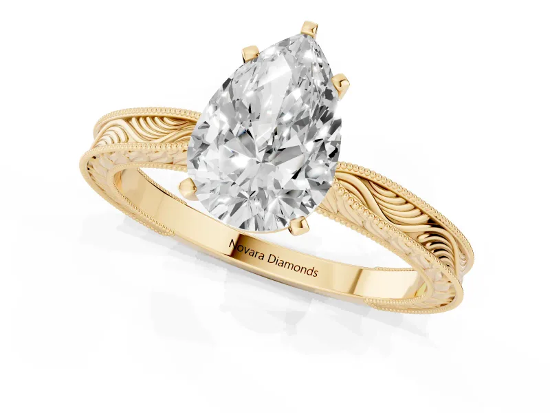 Pear Cut Diamond Solitaire Milgrain Engraved Band Set in Yellow gold with Prong Setting