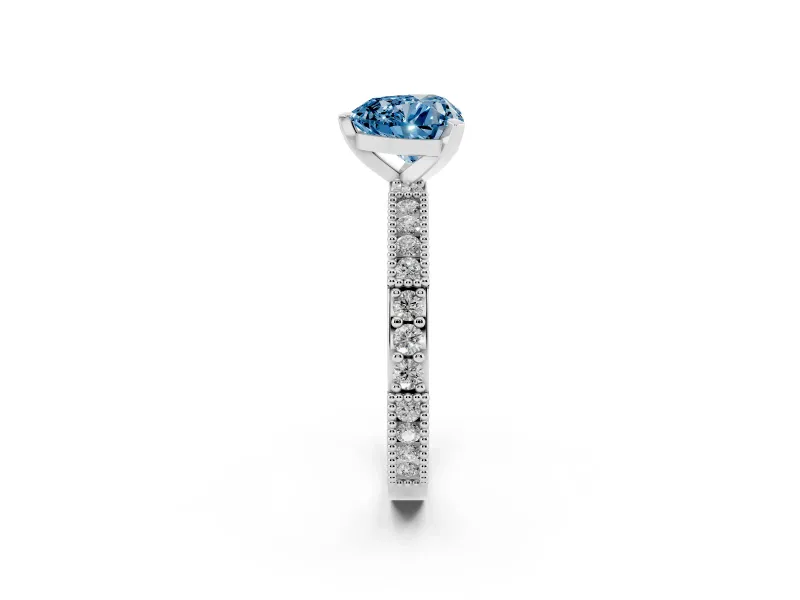 Fancy Blue Heart Cut Diamond Solitaire Ring Set in Platinum with Slim Pavé Band and Prong Setting