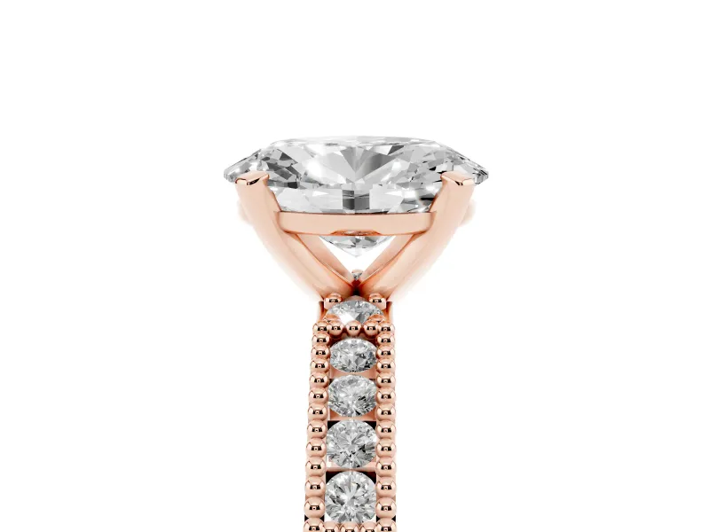 Oval Cut Diamond Solitaire Ring Set in Rose gold with Slim Pavé Band and Prong Setting