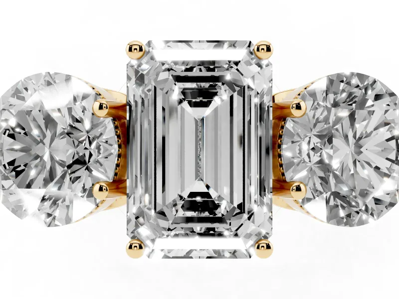 Emerald Cut Diamond Three-Stone Engagement Ring Set in Yellow gold with Polished Band