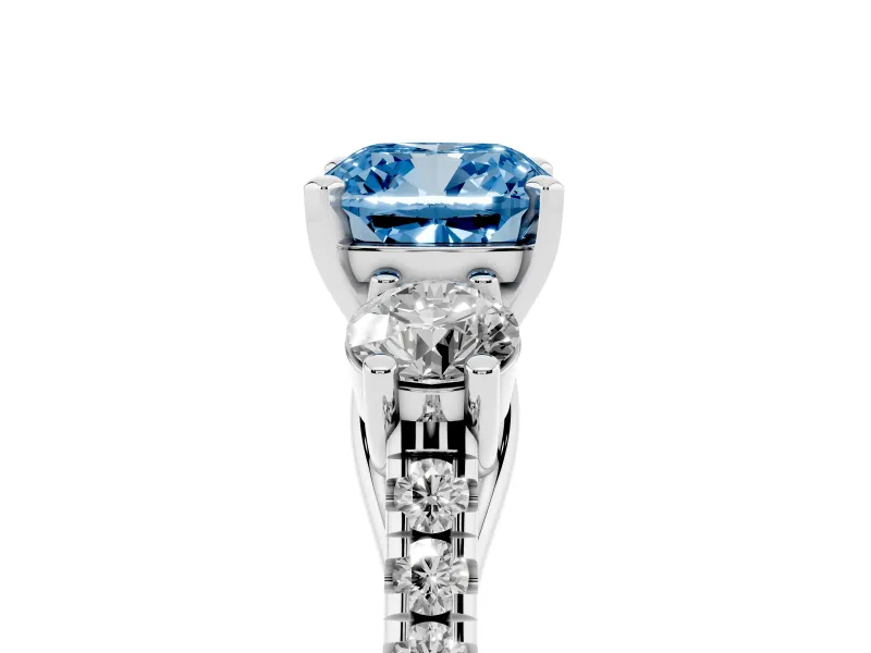 Fancy Blue Three-Stone Cushion Cut Diamond Pavé Band Ring Set in White gold with Prong-Set Trio