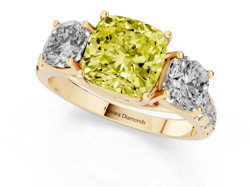 Fancy Yellow Cushion Cut Diamond Three-Stone Ring Set in Yellow gold with Pavé Band