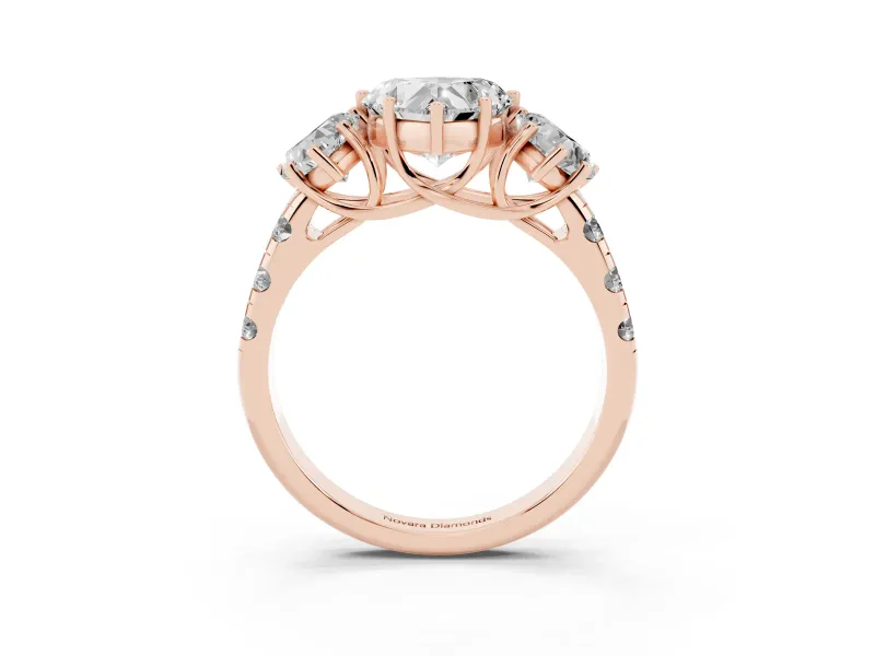 Heart Cut Diamond Three-Stone Ring Set in Rose gold with Pavé Band