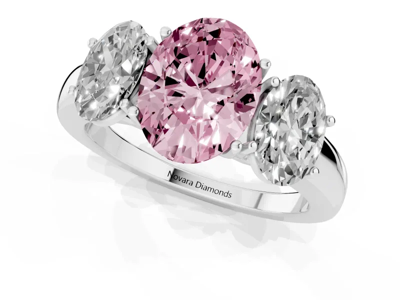 Fancy Pink Oval Cut Diamond Three-Stone Ring Set in Silver with Bold Center and Classic Band