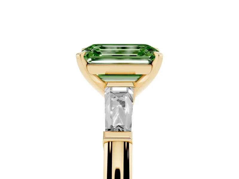 Fancy Green Emerald Cut Diamond Solitaire Ring Set in Yellow gold with Tapered Baguette Side Stones and Prong Setting