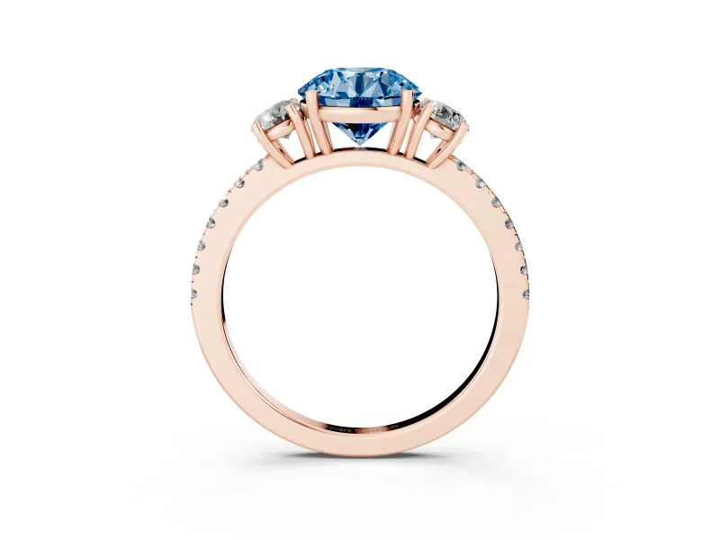 Fancy Blue Round Cut Diamond Three-Stone Ring Set in Rose gold with Pavé Band and Graduated Sides