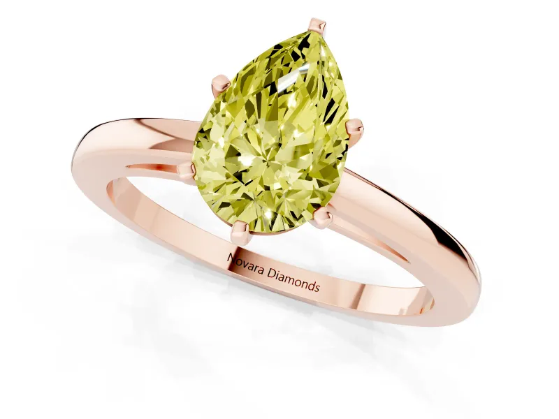 Fancy Yellow Pear Cut Diamond Solitaire Engagement Ring Set in Rose gold with Prong Setting on a Classic Band