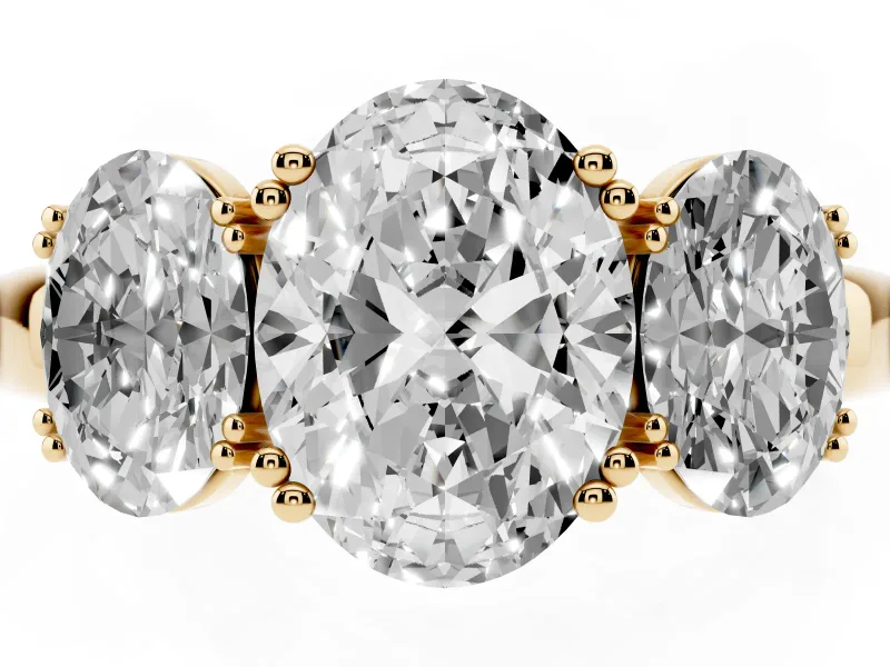 Oval Cut Diamond Three-Stone Ring Set in Yellow gold with Polished Band and Prong Setting