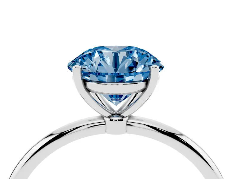 Fancy Blue Round Cut Diamond Solitaire Engagement Ring Set in Platinum with Thin Band and Prong Setting
