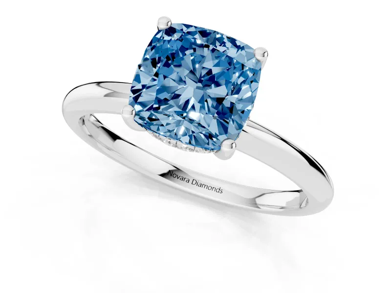Fancy Blue Cushion Cut Diamond Solitaire Engagement Ring Set in White gold with Prong Setting and Polished Band