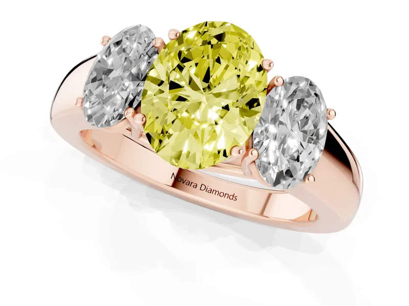 Fancy Yellow Three-Stone Oval Cut Diamond Ring Set in Rose gold with Matching Prong Settings and Plain Band