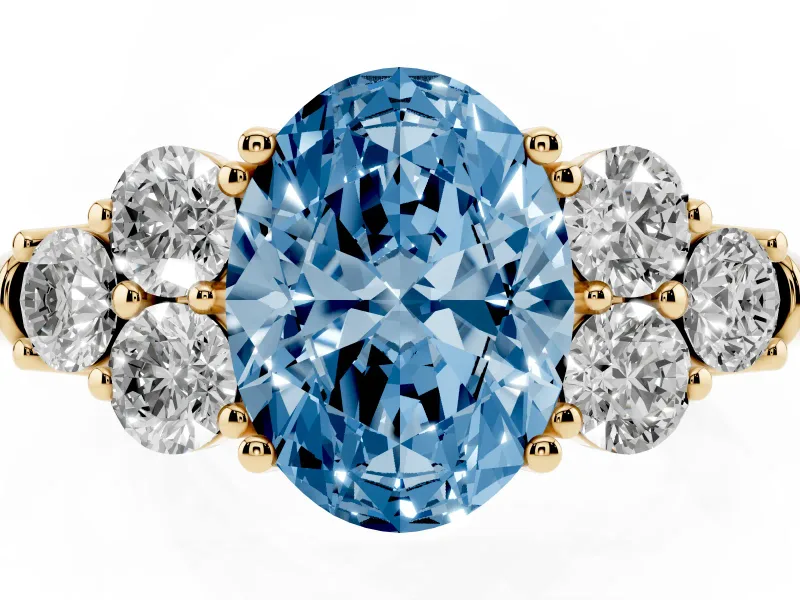 Oval Side Stone Engagement Ring Setting for a Fancy Blue Lab-Grown Diamond | Yellow Gold