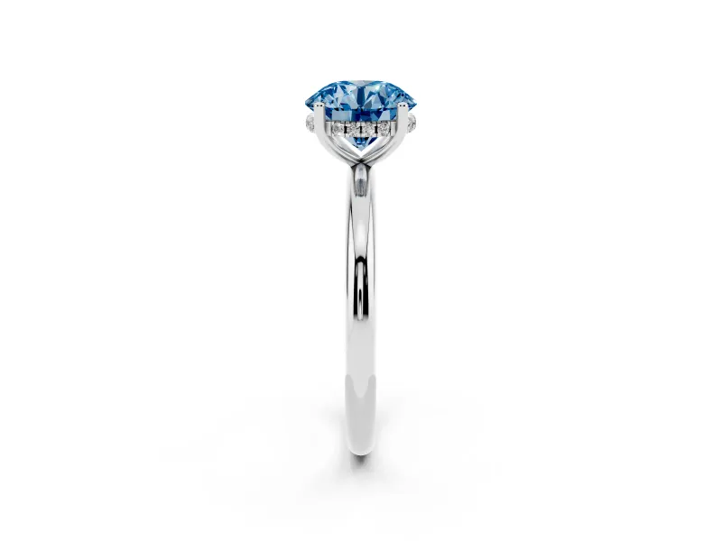 Fancy Blue Round Cut Diamond Solitaire Engagement Ring Set in Silver with Prong Setting and Polished Band