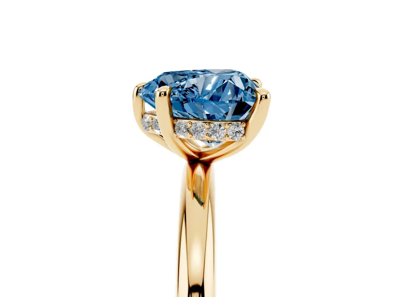 Fancy Blue Heart Cut Diamond Solitaire Ring Set in Yellow gold with Thin Band and Prong Setting