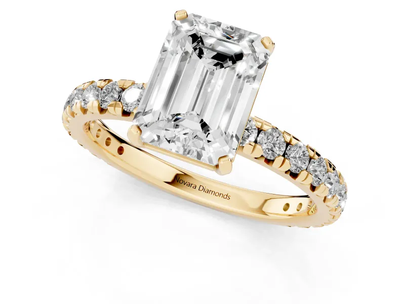 Emerald Cut Diamond Pavé Solitaire Ring Set in Yellow gold with Round Band and Prong Setting