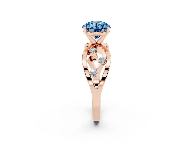 Fancy Blue Round Cut Diamond Solitaire Ring Set in Rose gold with Side Stones on Criss-Cross Band and Prong Setting