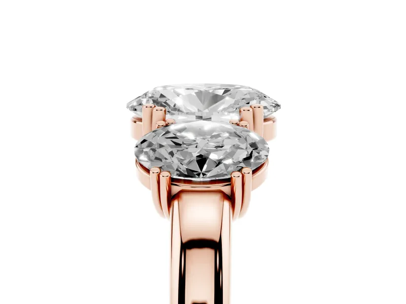 Oval Cut Diamond Three-Stone Ring Set in Rose gold with Polished Band and Prong Setting