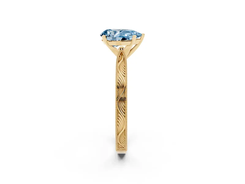 Fancy Blue Pear Cut Diamond Solitaire Milgrain Engraved Band Set in Yellow gold with Prong Setting
