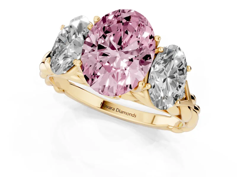 Fancy Pink Oval Cut Diamond Three-Stone Ring Set in Yellow gold with Braided Band