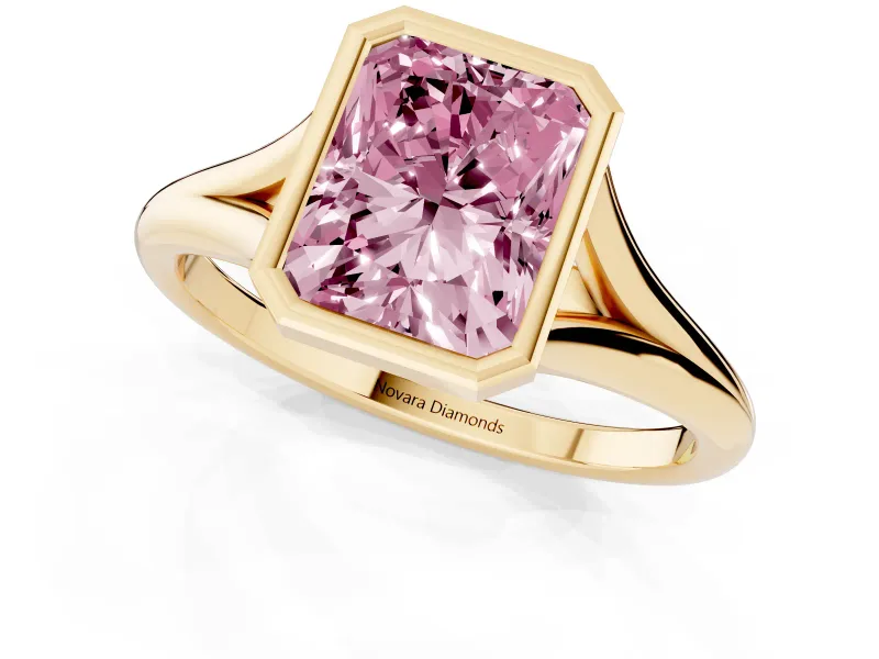 Fancy Pink Bezel Set Radiant Cut Diamond Solitaire Ring Set in Yellow gold with Tapered Band