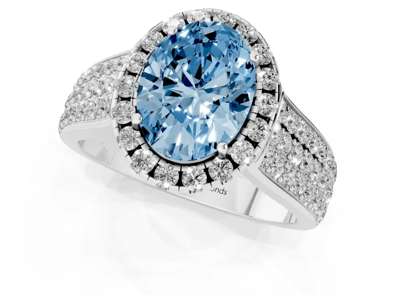 Fancy Blue Oval Cut Diamond Halo Ring Set in White gold with Pavé Band and Raised Center Setting